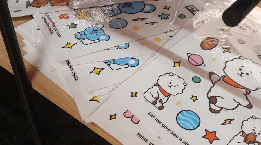 Close-up of cute BT21 character sticker sheets featuring the characters RJ and Koya