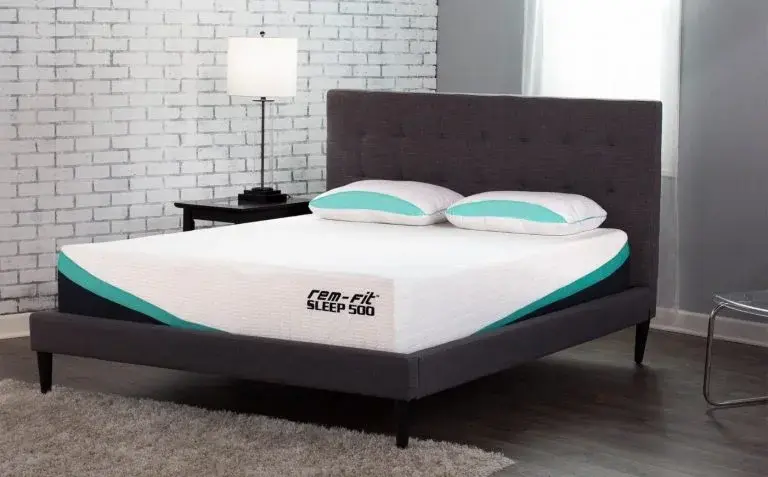 REM-Fit 500 Ortho mattress displayed on a grey upholstered bed frame