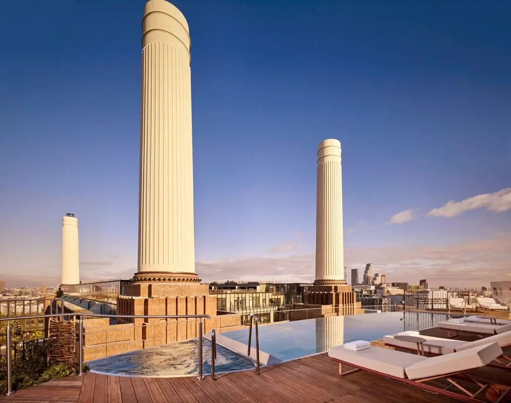 Rooftop infinity pool at Art'otel London Battersea Power Station with views of the iconic chimneys
