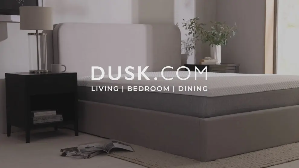 Dusk hybrid mattress on a bed base in a bedroom with bedside table and lamp