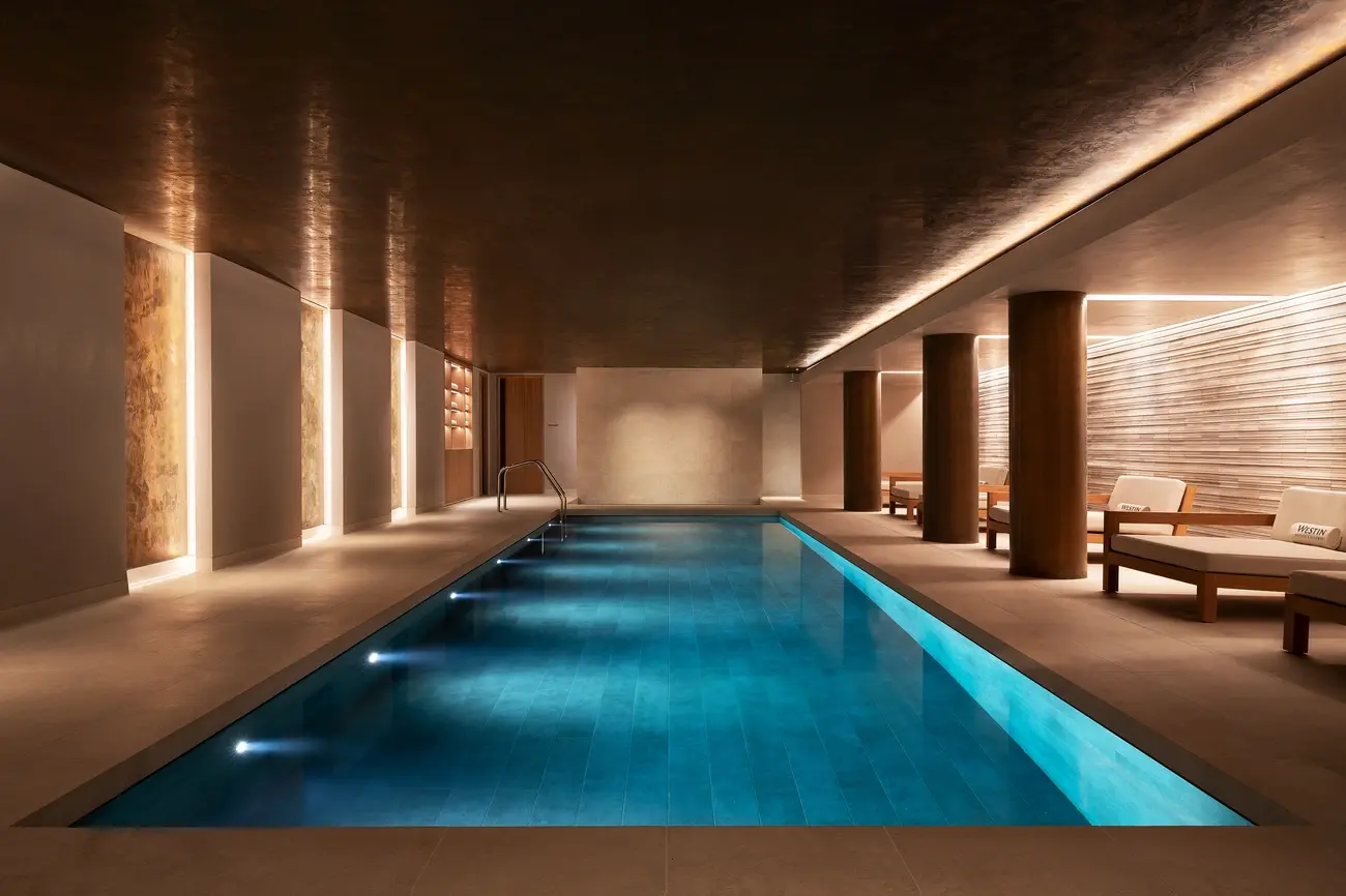 Elegant indoor swimming pool at the Heavenly Spa, The Westin London City, with relaxing lighting