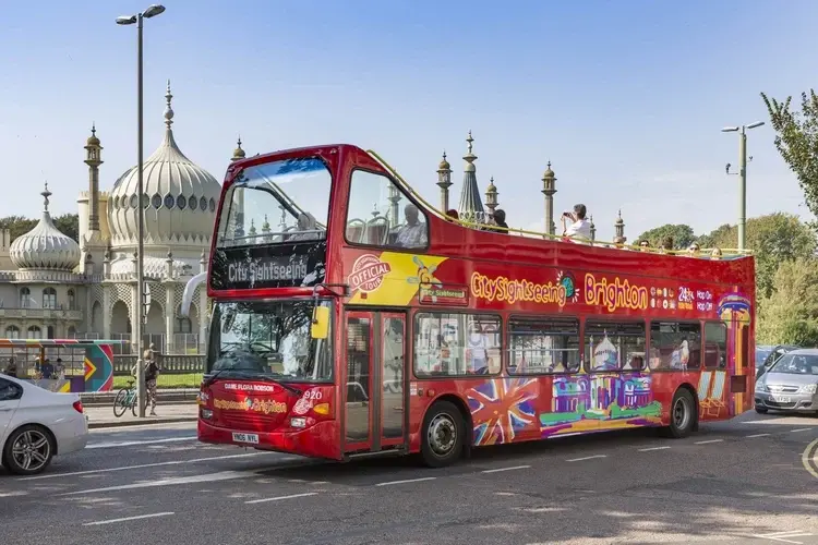 City Sightseeing open-top bus tour passing the Royal Pavilion, an easy Thing to Do in Brighton