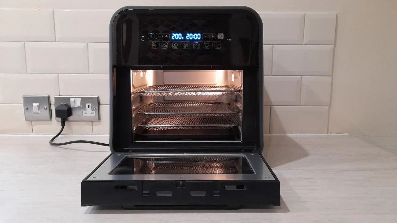 Breville Halo Rotisserie air fryer oven with door open showing internal racks