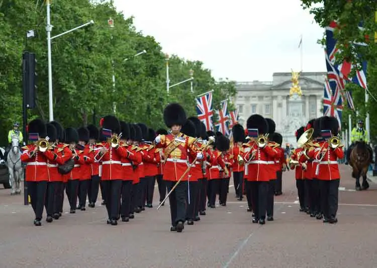 Guards band marches down The Mall for Changing of the Guard, a free Thing to Do in London with Kids