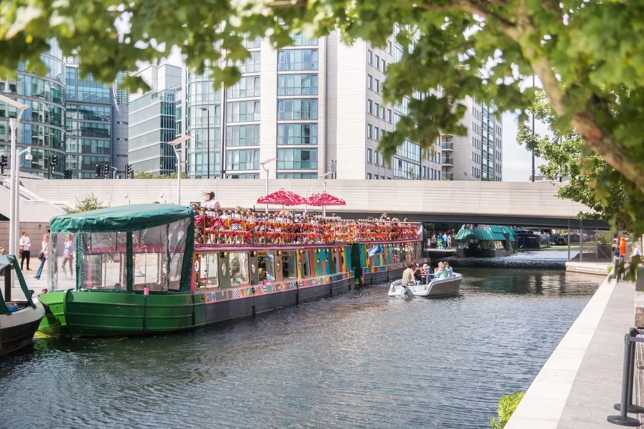 Colourful Darcie & May Green barges on the canal at Paddington, offering a unique brunch setting