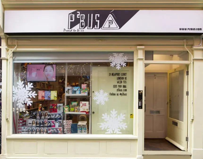 The cream-coloured storefront of the P2Bus K-beauty and K-pop shop on Newport Court in London