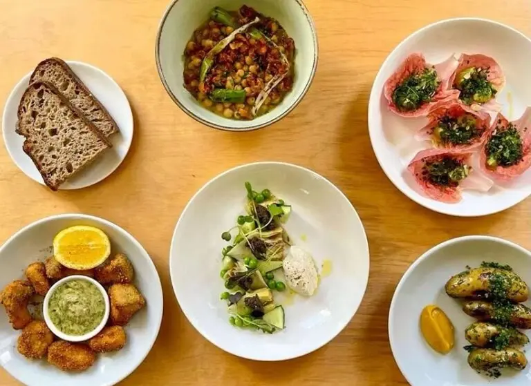 A spread of creative, seasonal "plant-first" small plates served at Tendril Kitchen in London