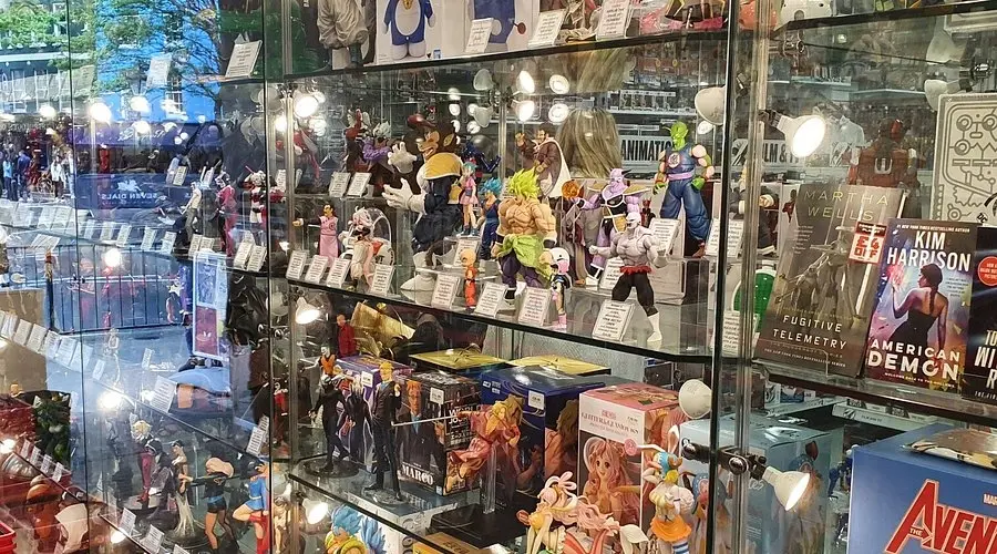 Glass display cabinets inside Forbidden Planet filled with detailed anime and pop culture collectible figurines