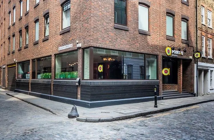 Exterior corner view of the Point A Hotel Liverpool Street on a cobbled London street