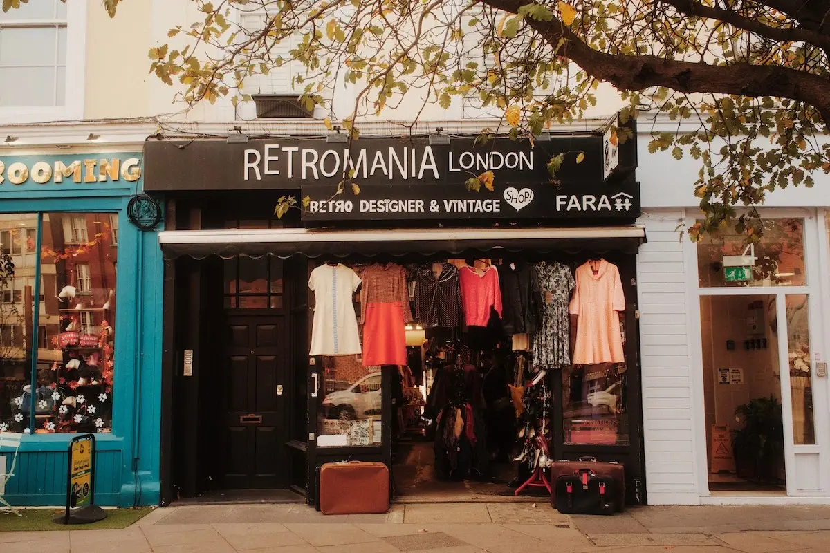 Vintage dresses and accessories on display at Retromania London, a FARA charity shop in Victoria