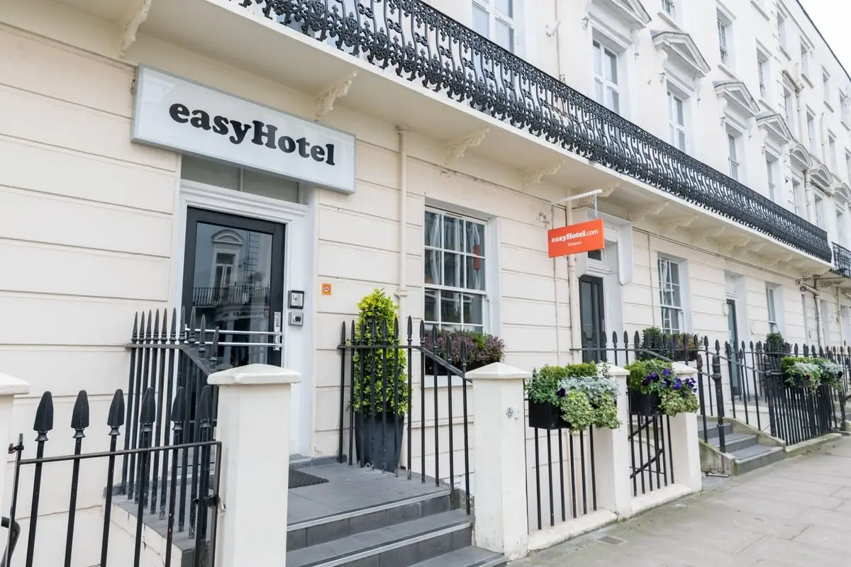 White facade and entrance of EasyHotel Victoria, a budget-friendly option in London