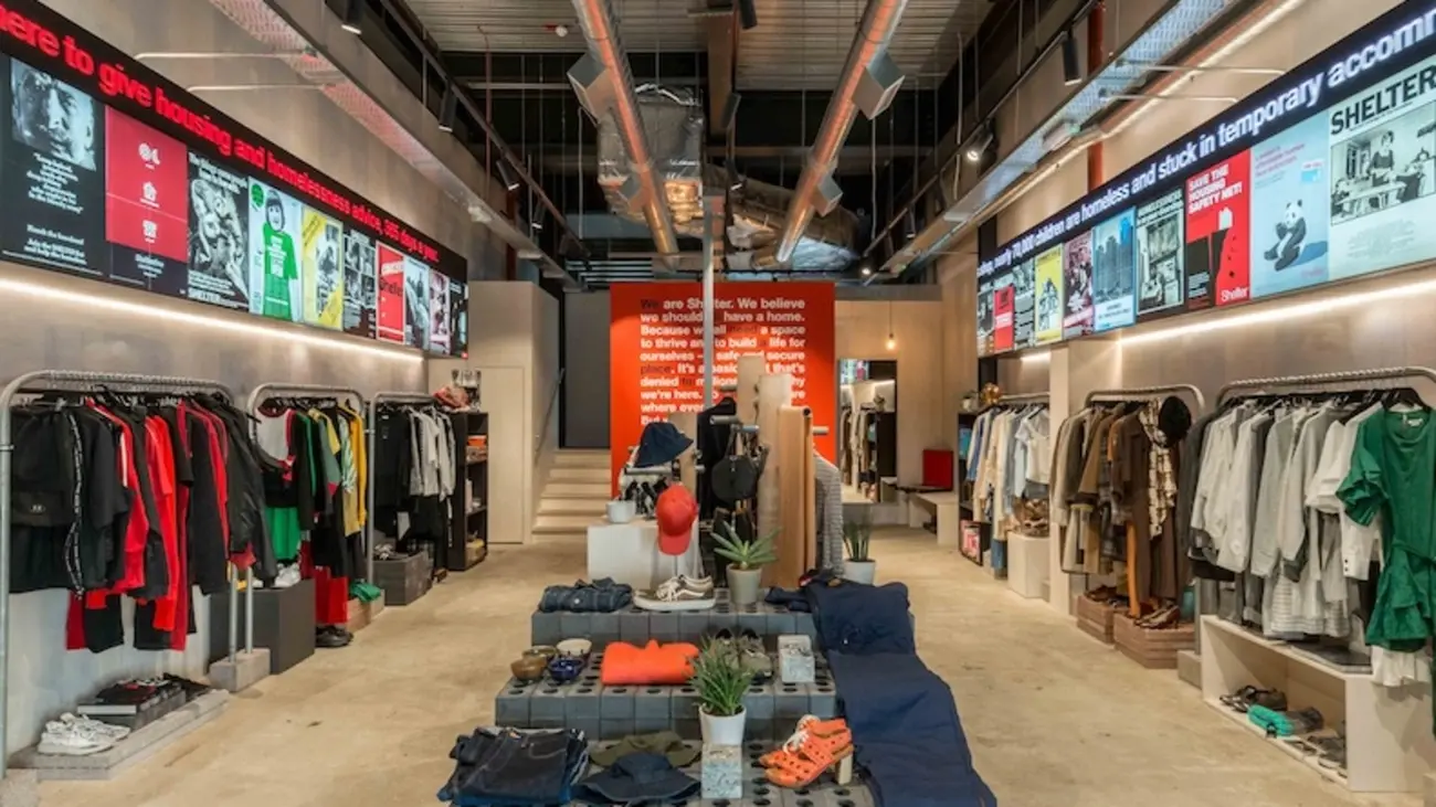 Modern interior of Boutique by Shelter in Coal Drops Yard, King's Cross, with curated clothing displays