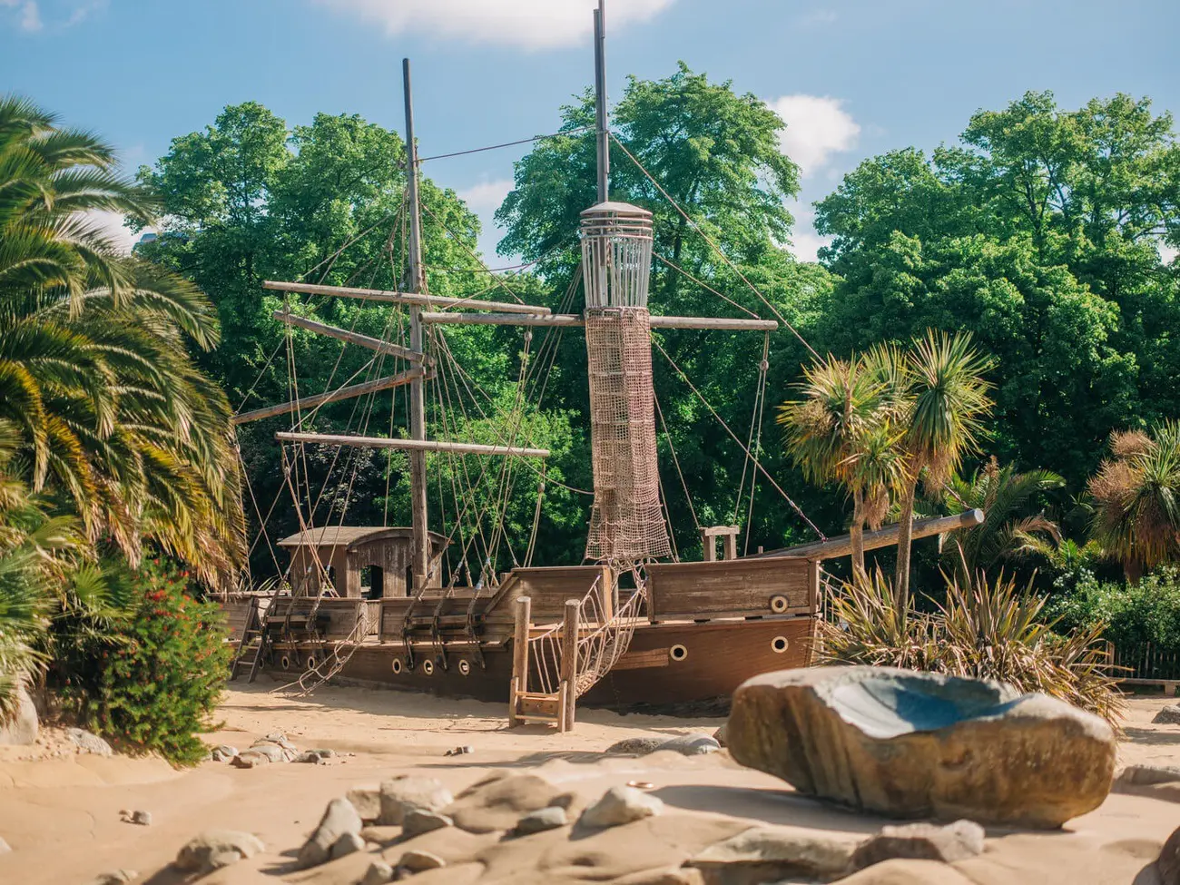 Wooden pirate ship in Diana Memorial Playground's sandy play area; a top Thing to Do in London with Kids