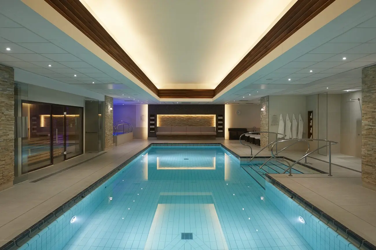 Calm indoor swimming pool at The Spa at The Landmark London with relaxing ambient lighting