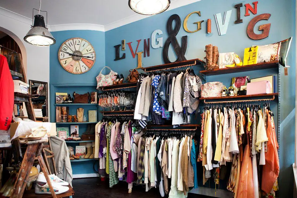 Mannequins displaying stylish second-hand outfits at Mary's Living & Giving charity shop in Richmond