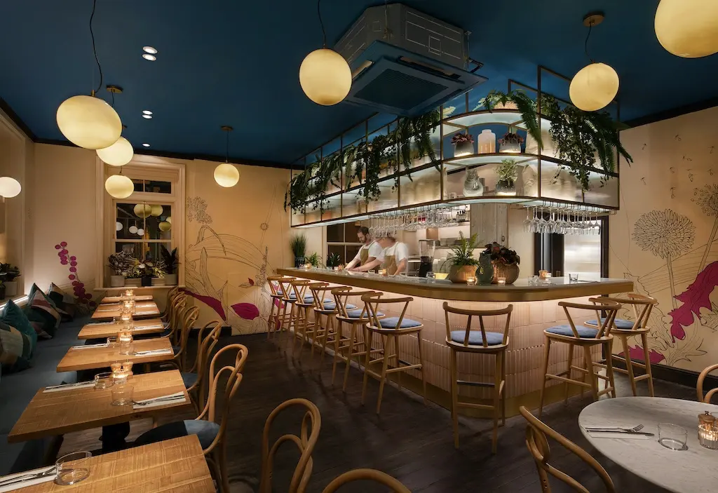 The exterior of Tofu Vegan, a Chinese restaurant in London with a traditional green-tiled entrance